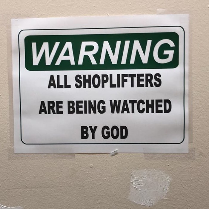 Sign: Warning: All shoplifters are being watched by God.